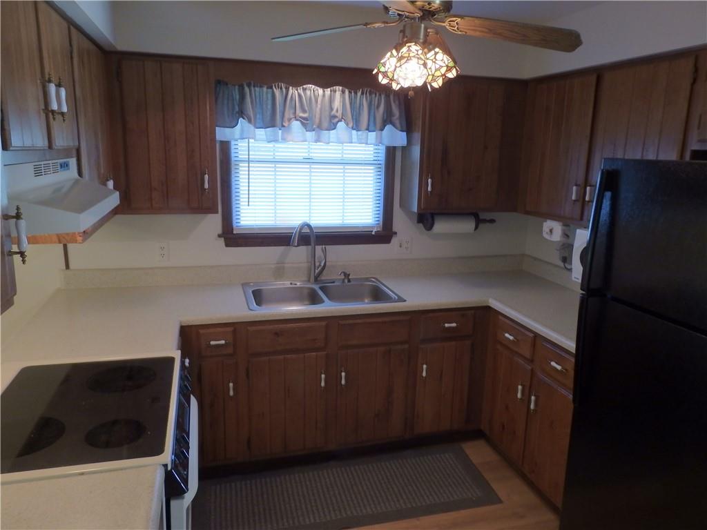 7111 Country Club Road Butler, PA 16001 - Photo 10 of 25 a kitchen with cabinets a sink stainless steel appliances and a window
