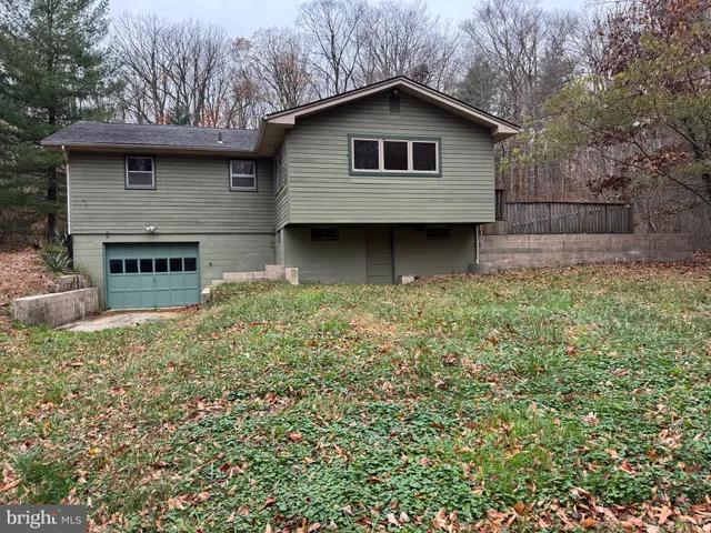 a house with trees in the background