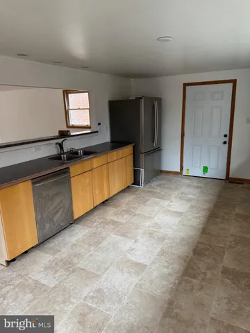 a view of a kitchen with a sink