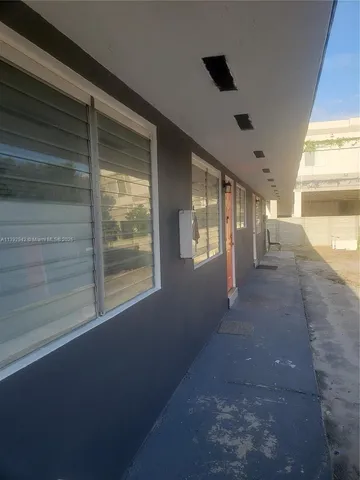 a view of a backyard with sitting area