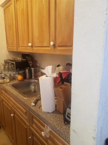 a bathroom with a sink mirror and toilet