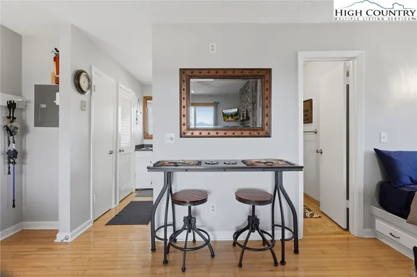 a view of a dining room with furniture and wooden floor