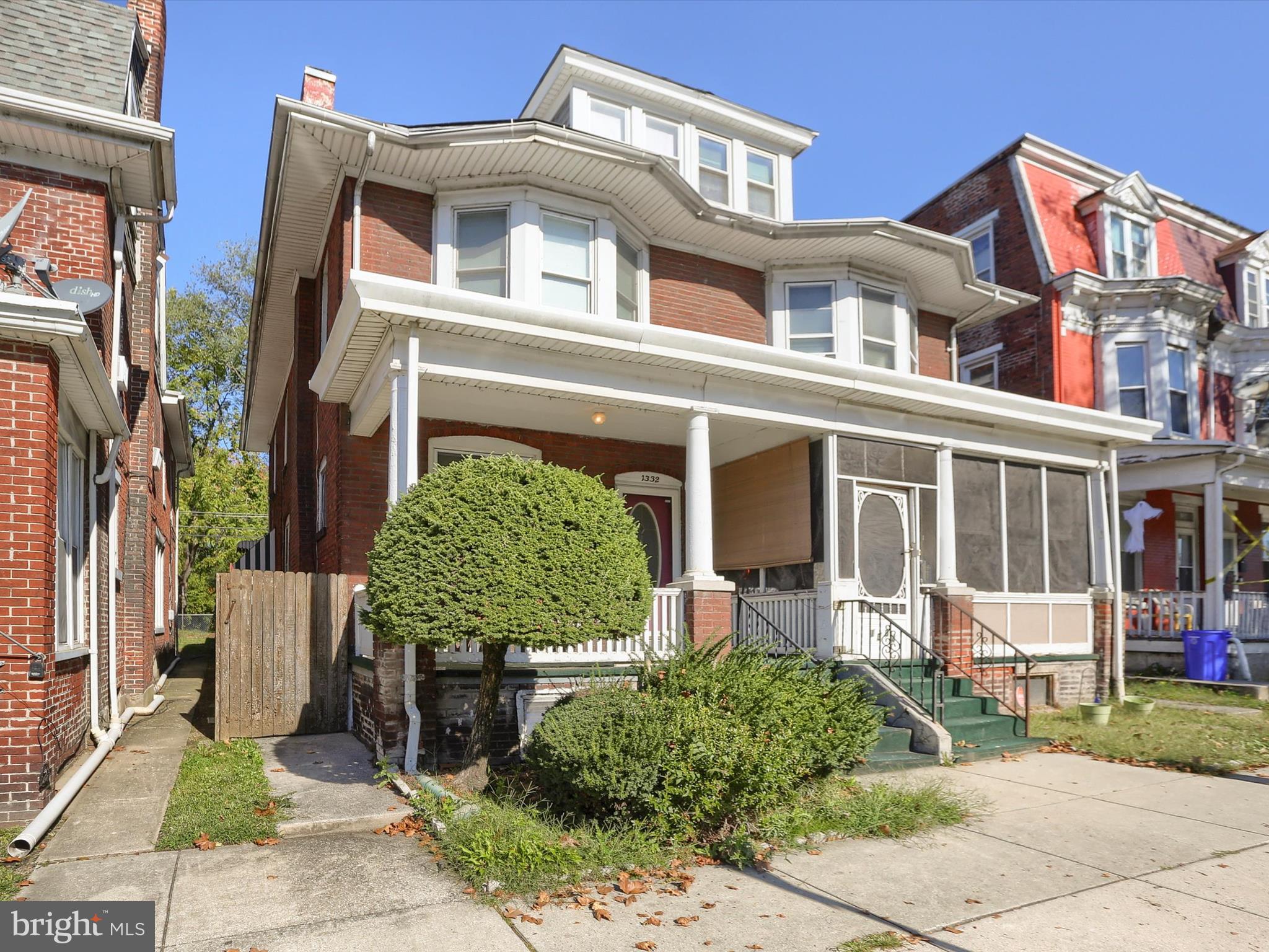 1332 State Street Harrisburg, PA 17103 - Photo 59 of 59 front view of a brick house with a yard