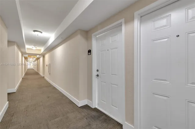 a view of an empty room with a fireplace