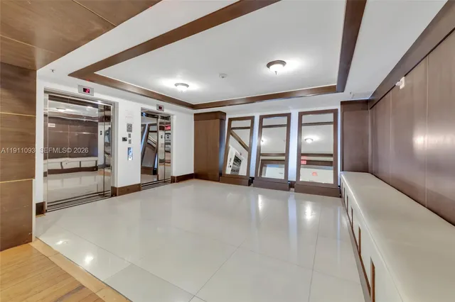 a view of hallway with a white walls