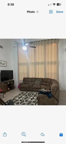 a black and white photo of a living room