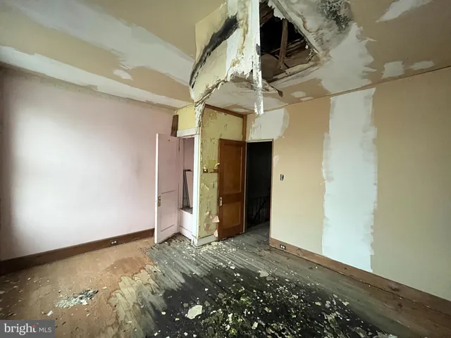 a bathroom with a granite countertop shower and a sink
