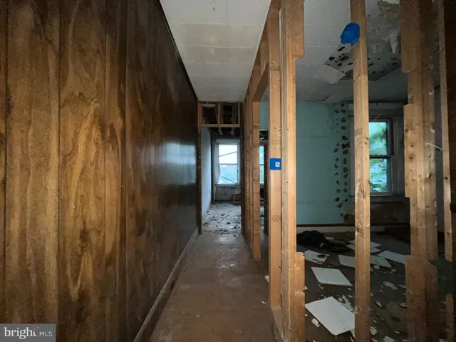 a bathroom with a granite countertop shower and a sink