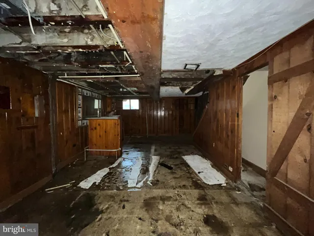 a view of a room with wooden walls