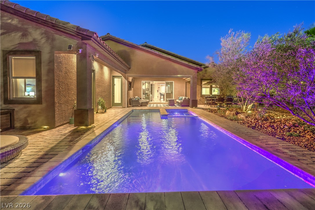 7119 Arabian Ridge Street Las Vegas, NV 89131 - Photo 44 of 73 An inviting backyard oasis offers a sparkling pool with integrated spa and ample entertaining spaces.