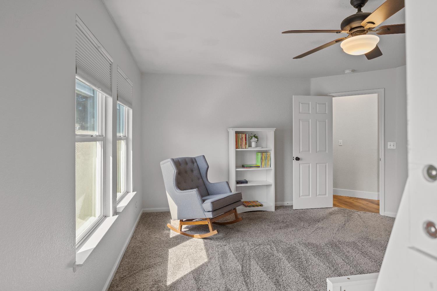 637 Rebekah Court Ripon, CA 95366 - Photo 35 of 69 a living room with furniture a flat screen tv and a window