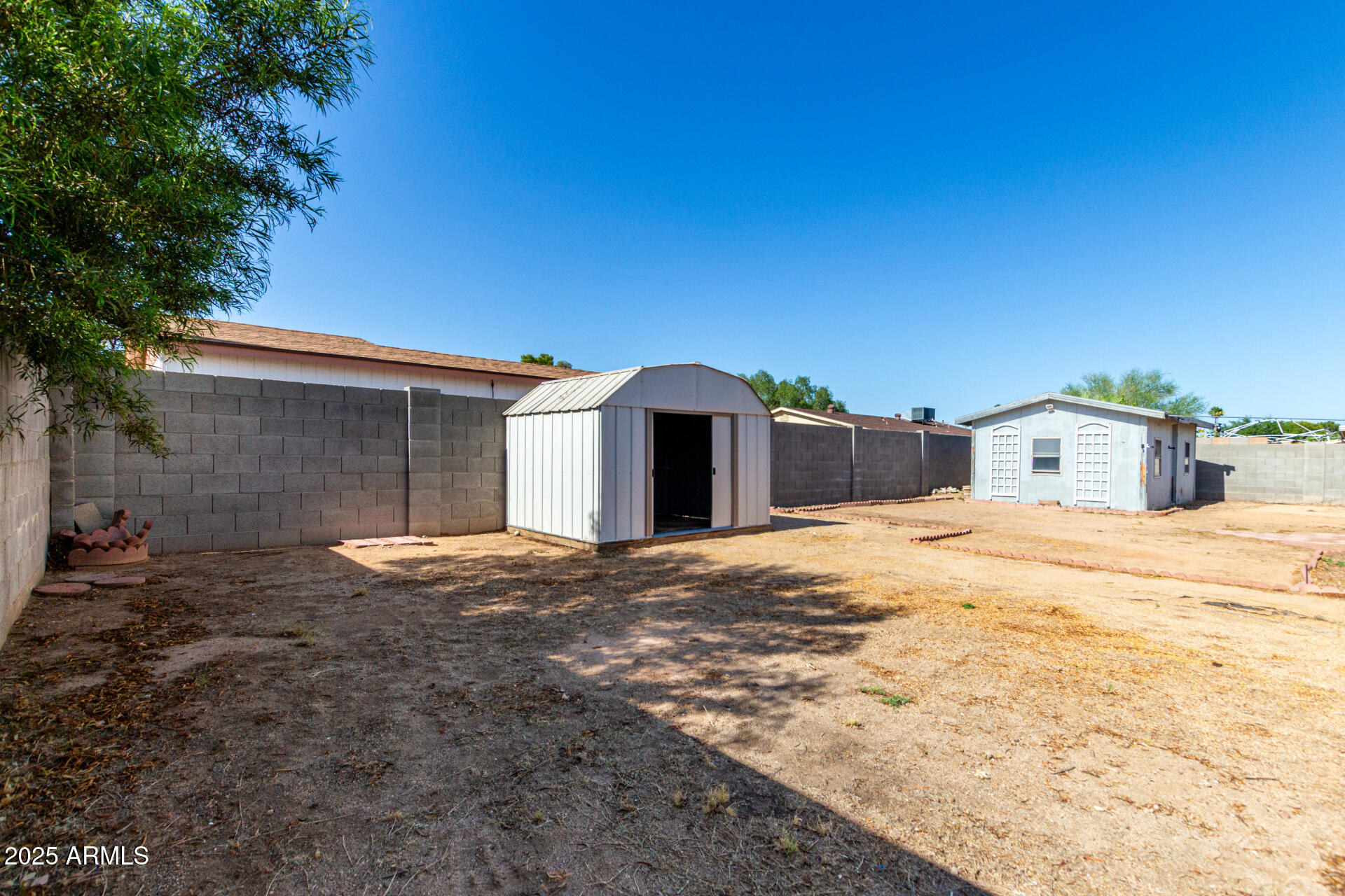 4740 West Bloomfield Road Glendale, AZ 85304 - Photo 33 of 34 a house with trees in the background