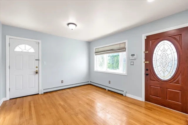 wooden floor in a room with a window