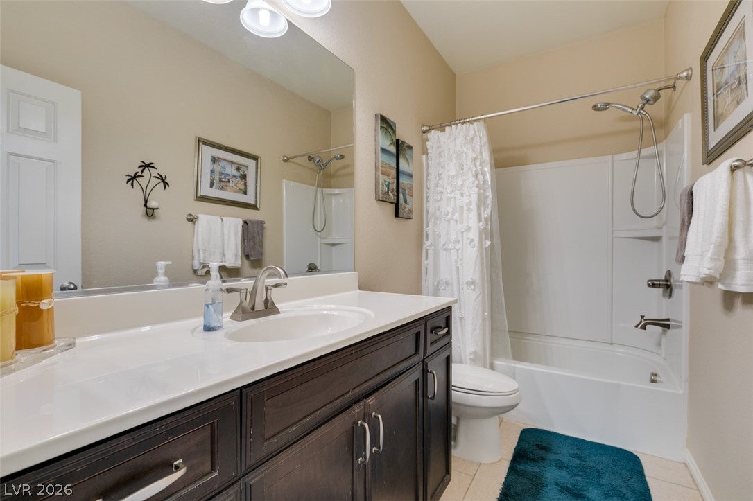 7375 Campbell Ranch Avenue Las Vegas, NV 89179 - Photo 30 of 45 A well-appointed bathroom offers a single vanity with ample counter space and a full shower-tub combination.