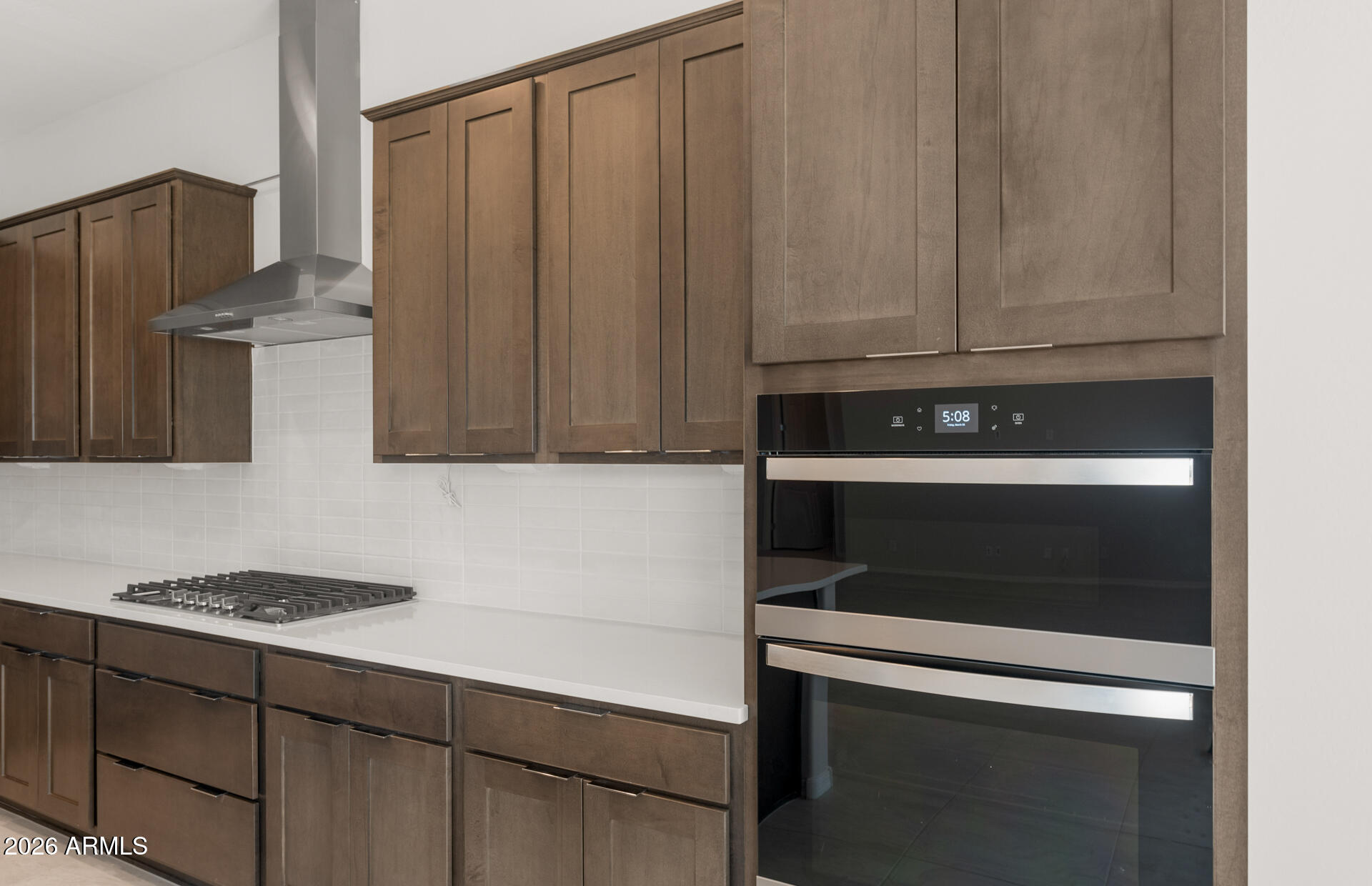 16081 West Bajada Road Surprise, AZ 85387 - Photo 13 of 28 a kitchen with granite countertop cabinets and steel appliances