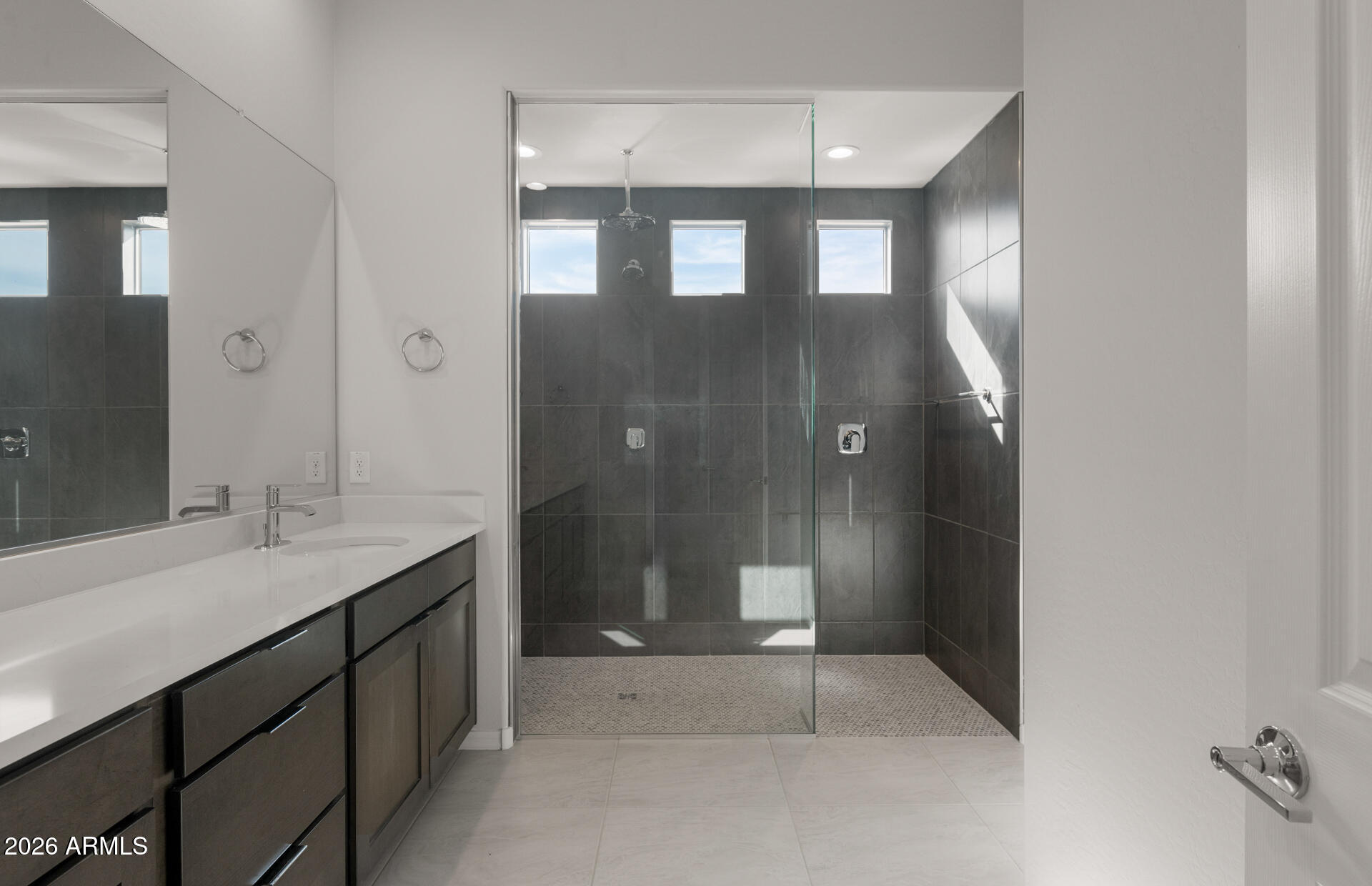 16081 West Bajada Road Surprise, AZ 85387 - Photo 21 of 28 a bathroom with a sink and a mirror