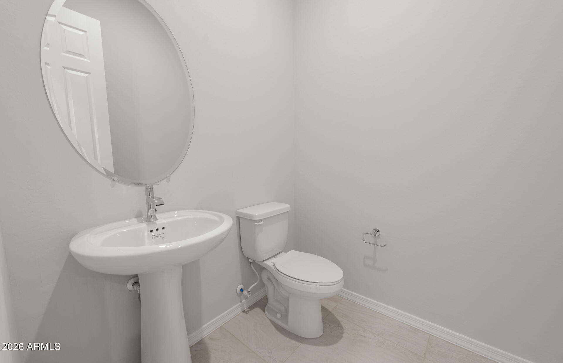 16081 West Bajada Road Surprise, AZ 85387 - Photo 25 of 28 a white toilet sitting next to a white sink