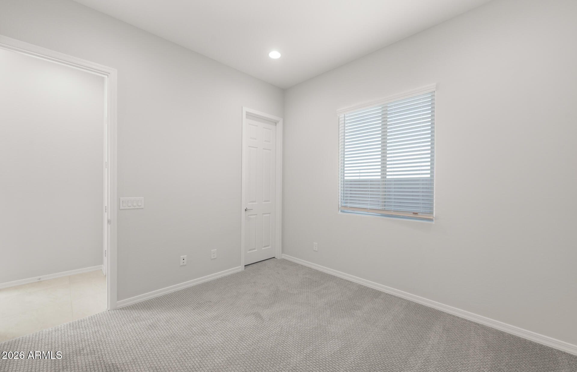 16081 West Bajada Road Surprise, AZ 85387 - Photo 5 of 28 a view of an empty room with a window