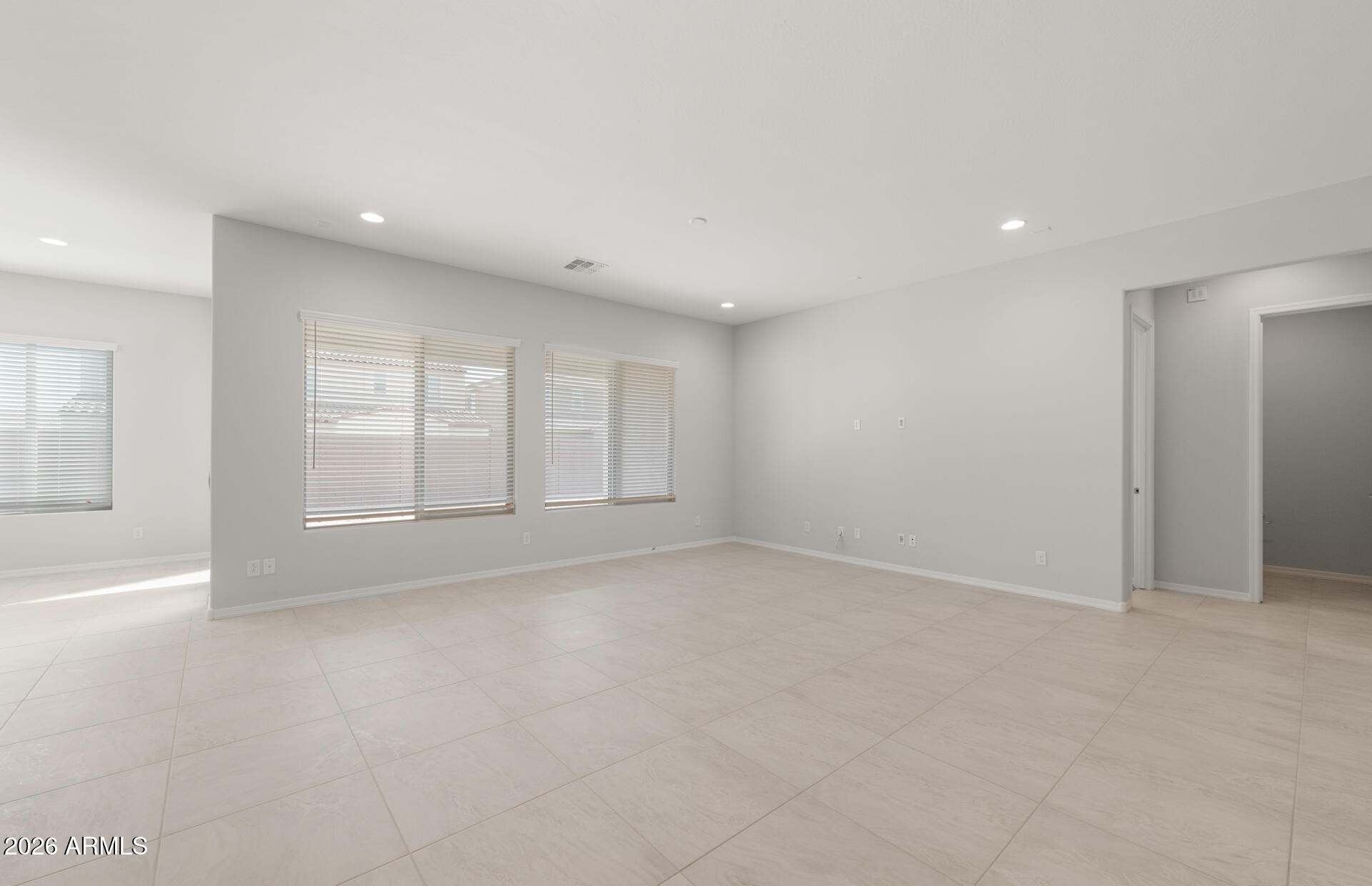 16081 West Bajada Road Surprise, AZ 85387 - Photo 8 of 28 a view of an empty room with a window