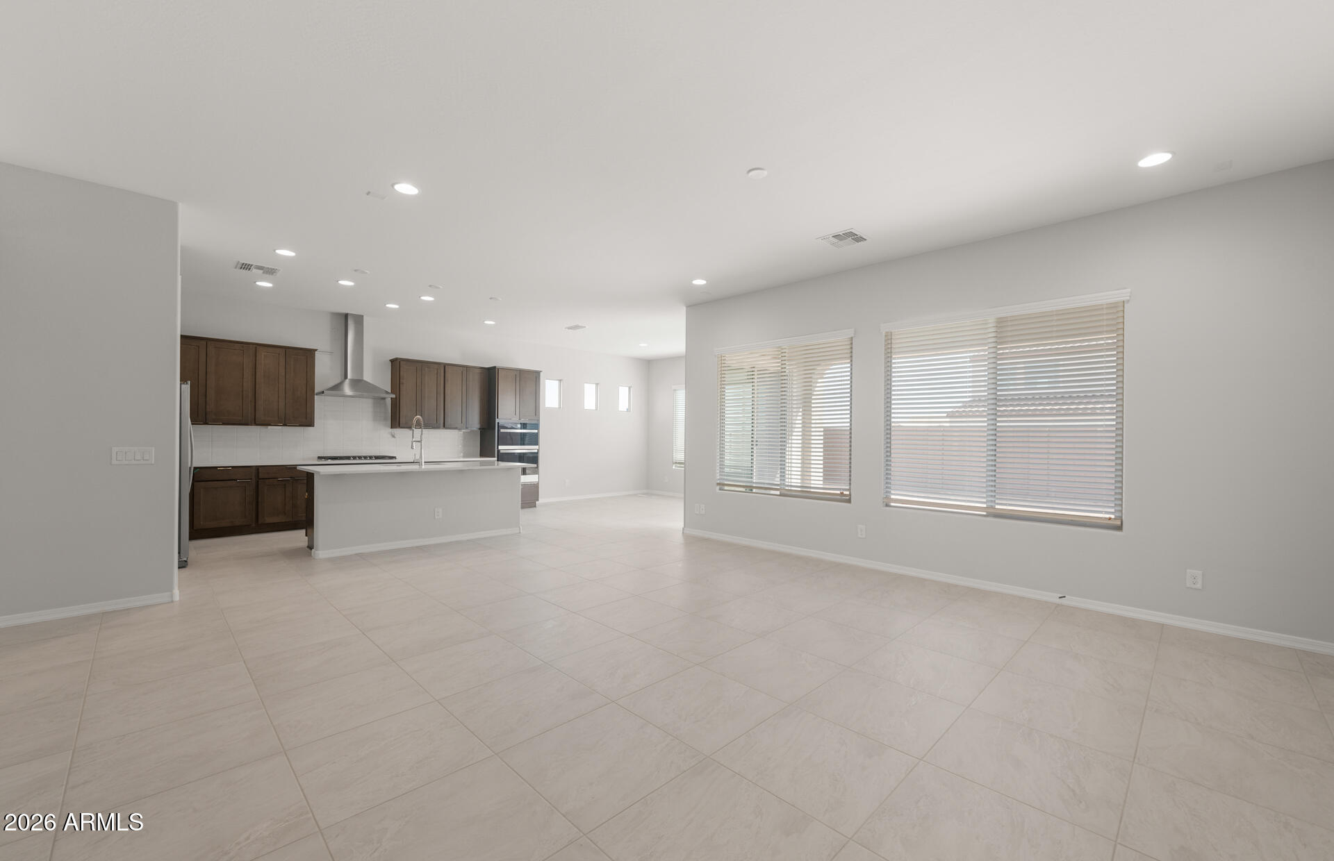 16081 West Bajada Road Surprise, AZ 85387 - Photo 9 of 28 a view of kitchen with kitchen island and stainless steel appliances
