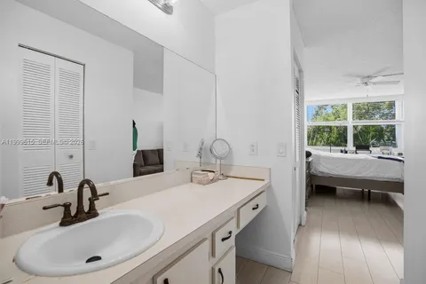 a bathroom with a double vanity sink and mirror