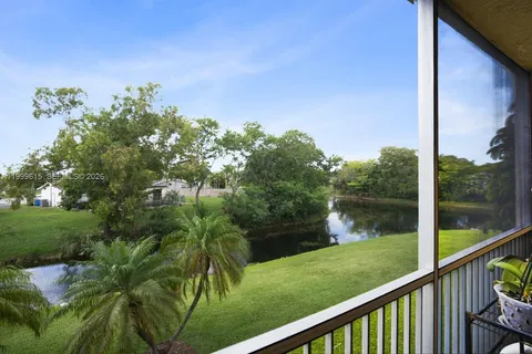 a view of a lake from a balcony with outdoor space