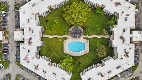 aerial view of multiple houses with yard
