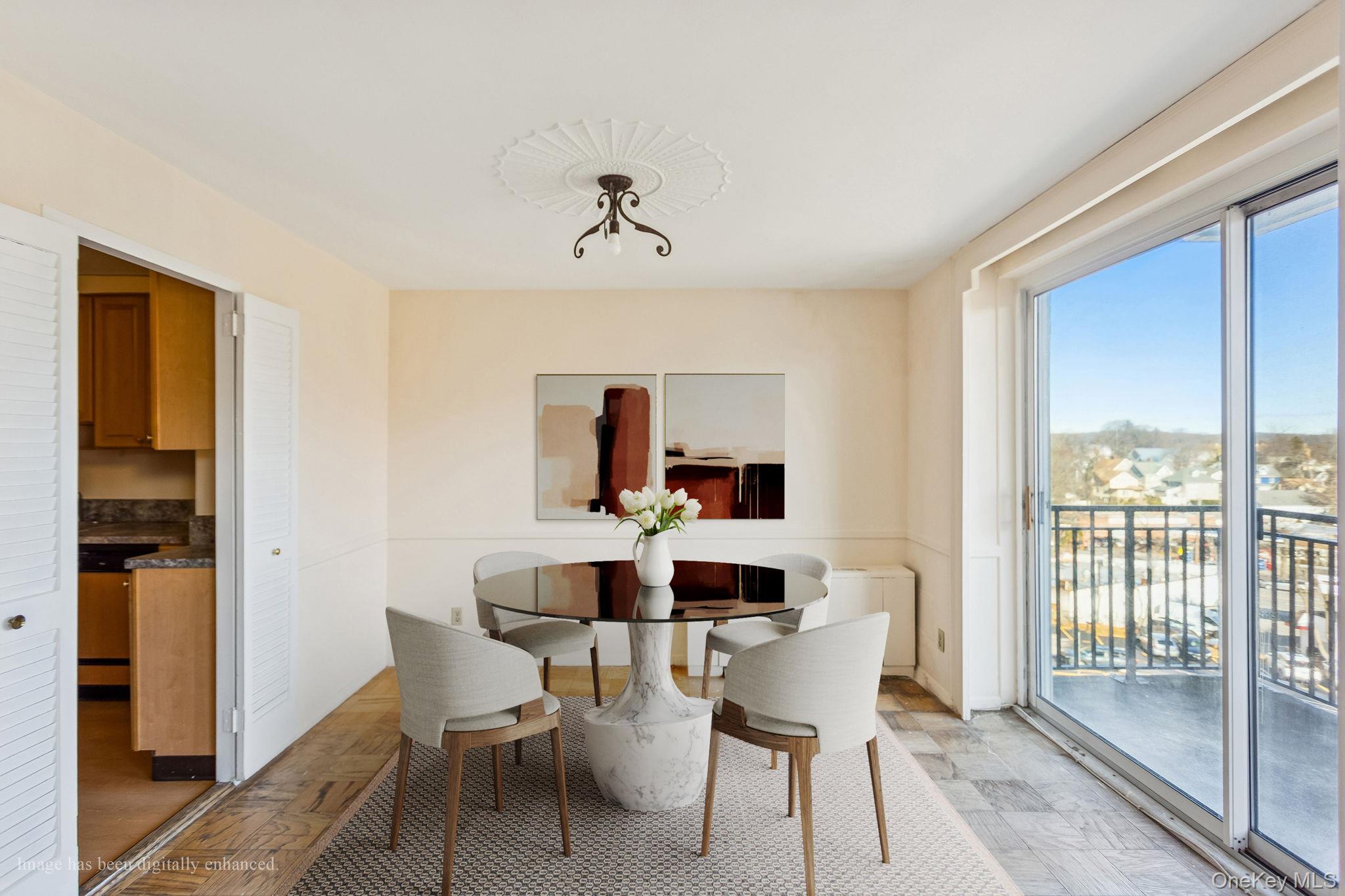 20 Old Mamaroneck Road, Unit 5Q White Plains, NY 10605 - Photo 7 of 18 a dining room with furniture and window