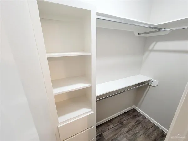a view of an empty walk in closet