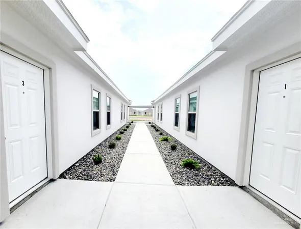 a view of a hallway with staircase
