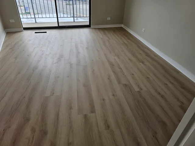 a view of room with wooden floor
