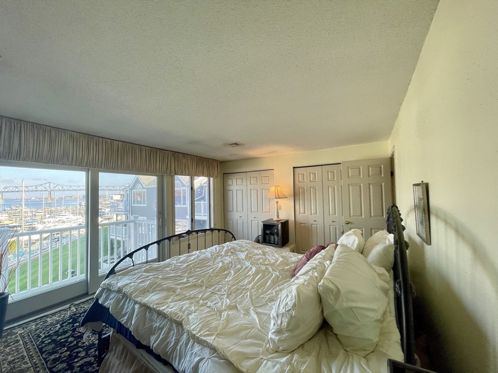 700 Shore Drive, Unit 6604 Fall River, MA 02721 - Photo 11 of 32 a bed sitting in a bedroom next to a window