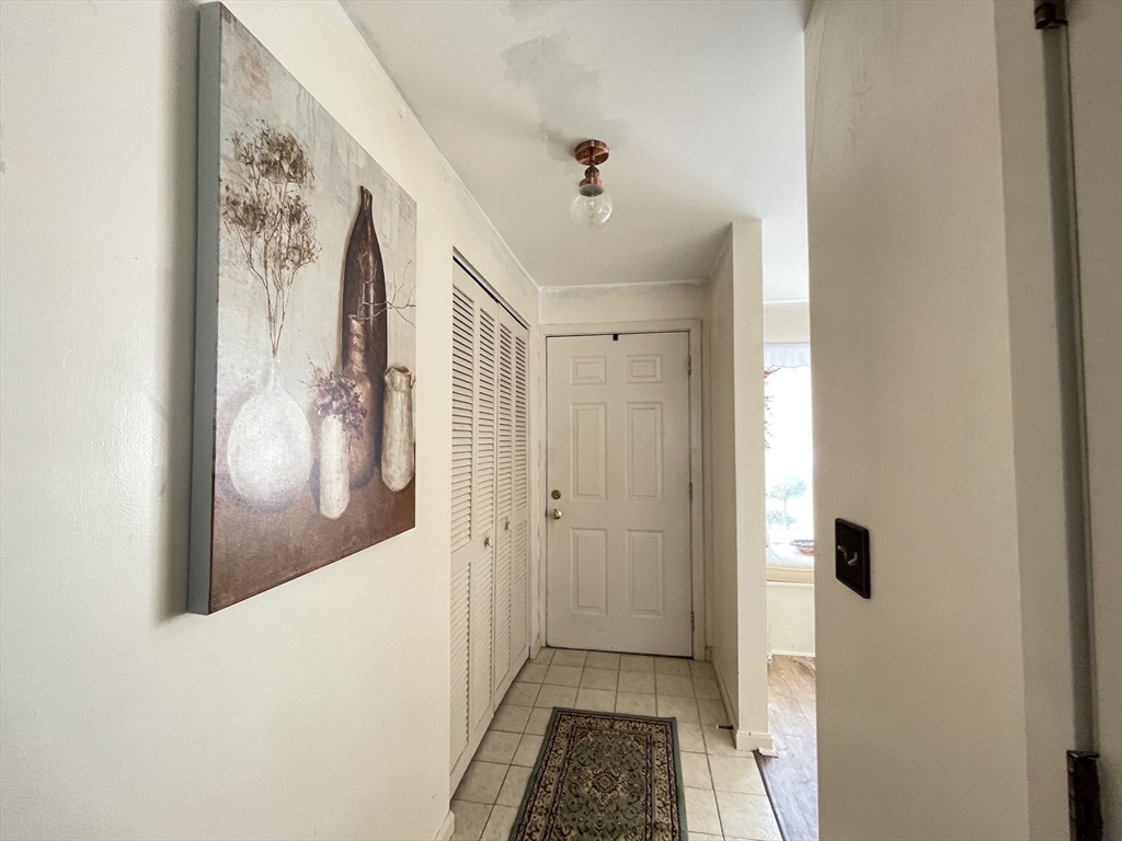 700 Shore Drive, Unit 6604 Fall River, MA 02721 - Photo 18 of 32 a view of a hallway with wooden floor and a bathroom