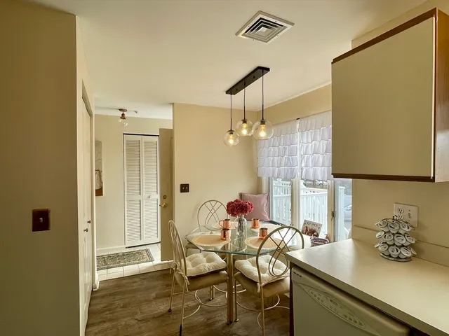 a living room with furniture window and a flat screen tv