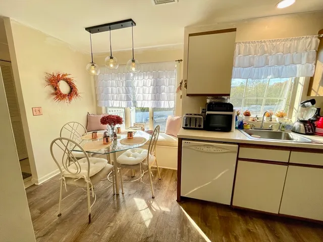 a kitchen with stainless steel appliances a refrigerator stove and microwave