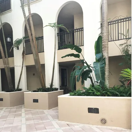 a view of balcony with furniture