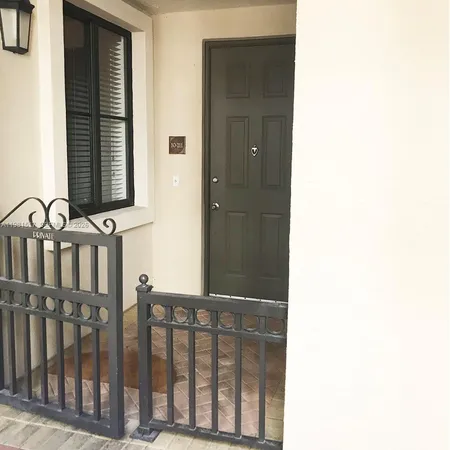 a view of a porch with a small yard