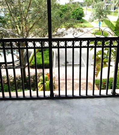 a view of a livingroom with furniture wooden floor and window