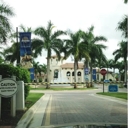 a sign board with buildings in the background