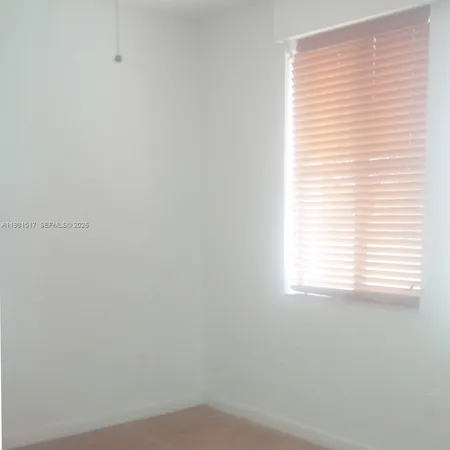 a view of a room that has a window in it