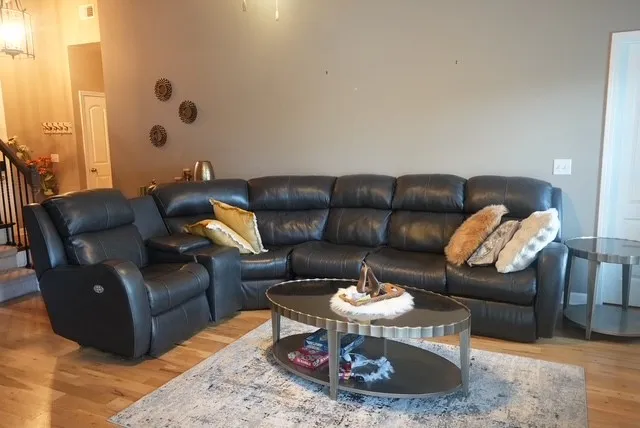 a living room with furniture and a table