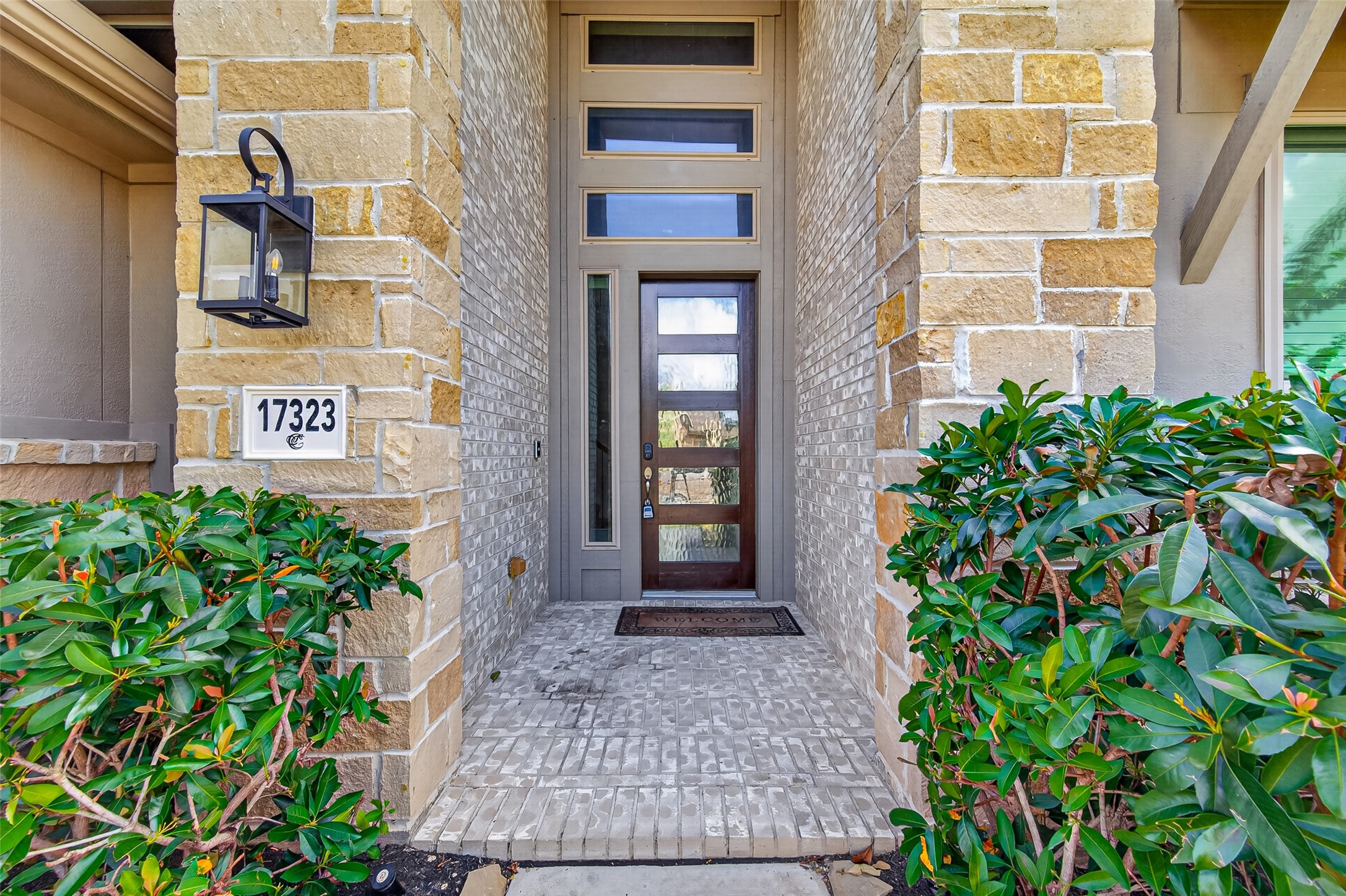 17323 Grand Canyon Road Conroe, TX 77302 - Photo 2 of 40 The high ceiling at the front entry with multiple window lights is both trendy and timeless in appeal.