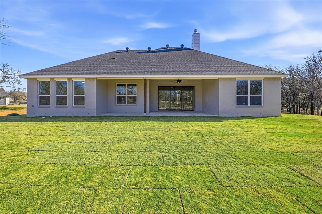 1053 Llano Way Poolville, TX 76487 - Photo 40 of 40 a front view of a house with garden