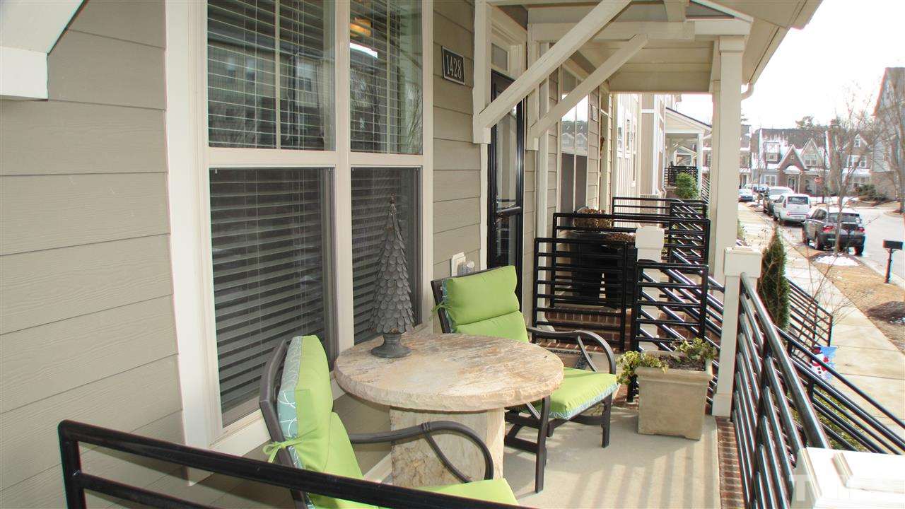 1428 Crafton Way Raleigh, NC 27607 - Photo 3 of 25 a balcony with table and chairs