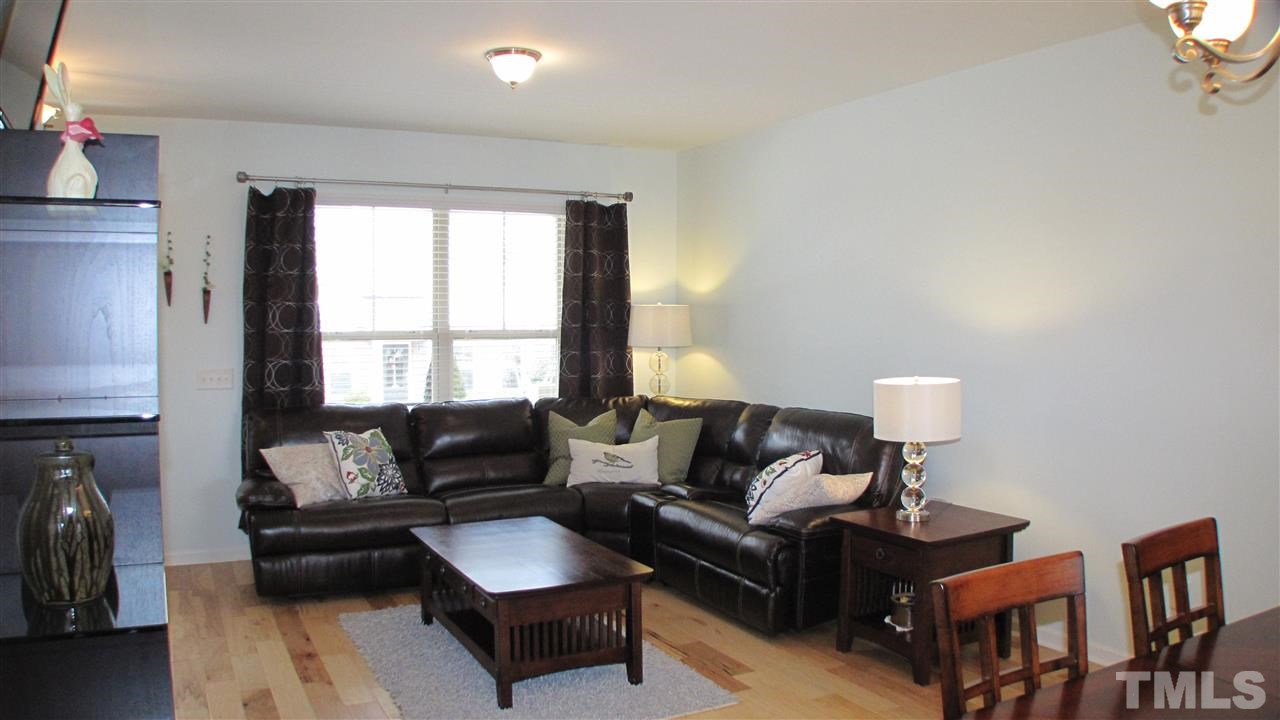 1428 Crafton Way Raleigh, NC 27607 - Photo 25 of 25 a living room with furniture and a window