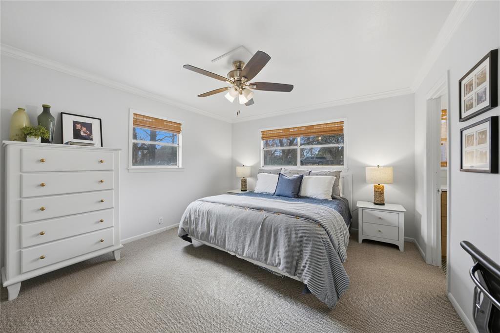 111 Ridgeoak Way Tool, TX 75143 - Photo 9 of 24 a bed room with a bed and a ceiling fan