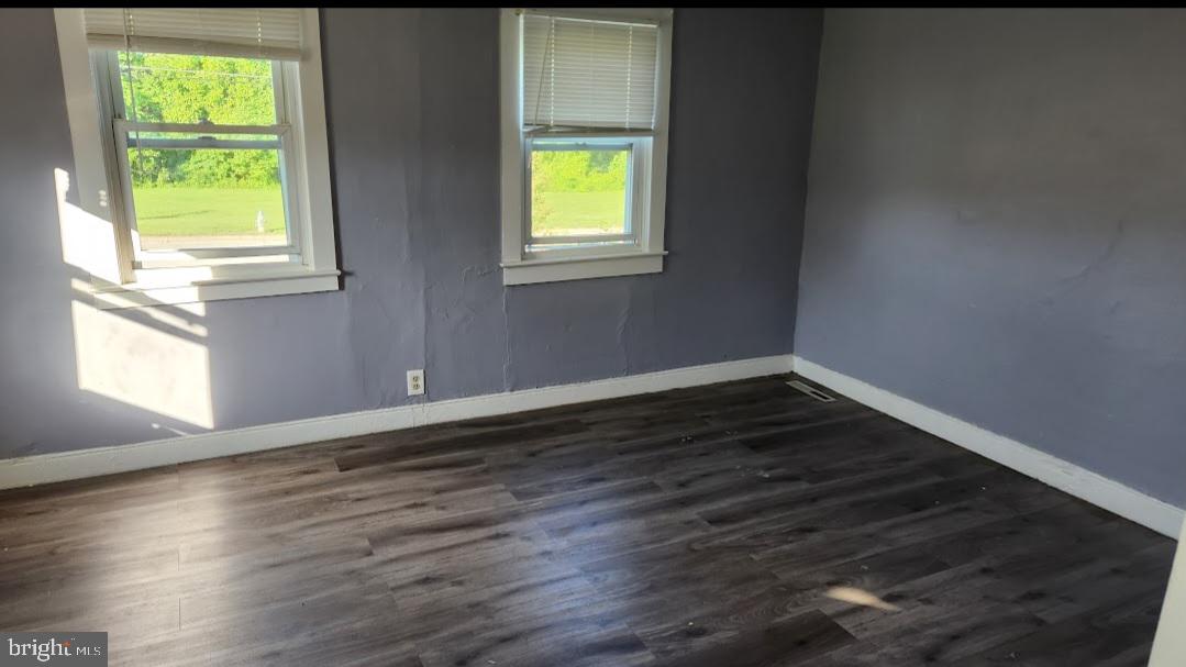 20 Church Landing Road Pennsville, NJ 08070 - Photo 12 of 22 an empty room with wooden floor and windows