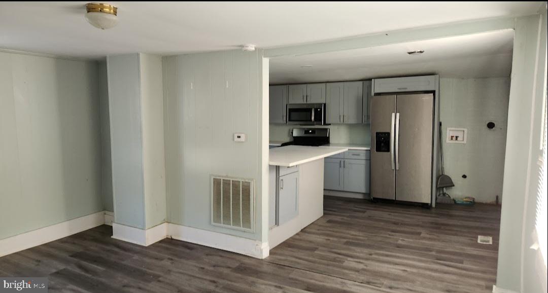 20 Church Landing Road Pennsville, NJ 08070 - Photo 14 of 22 a kitchen with white cabinets and stainless steel appliances