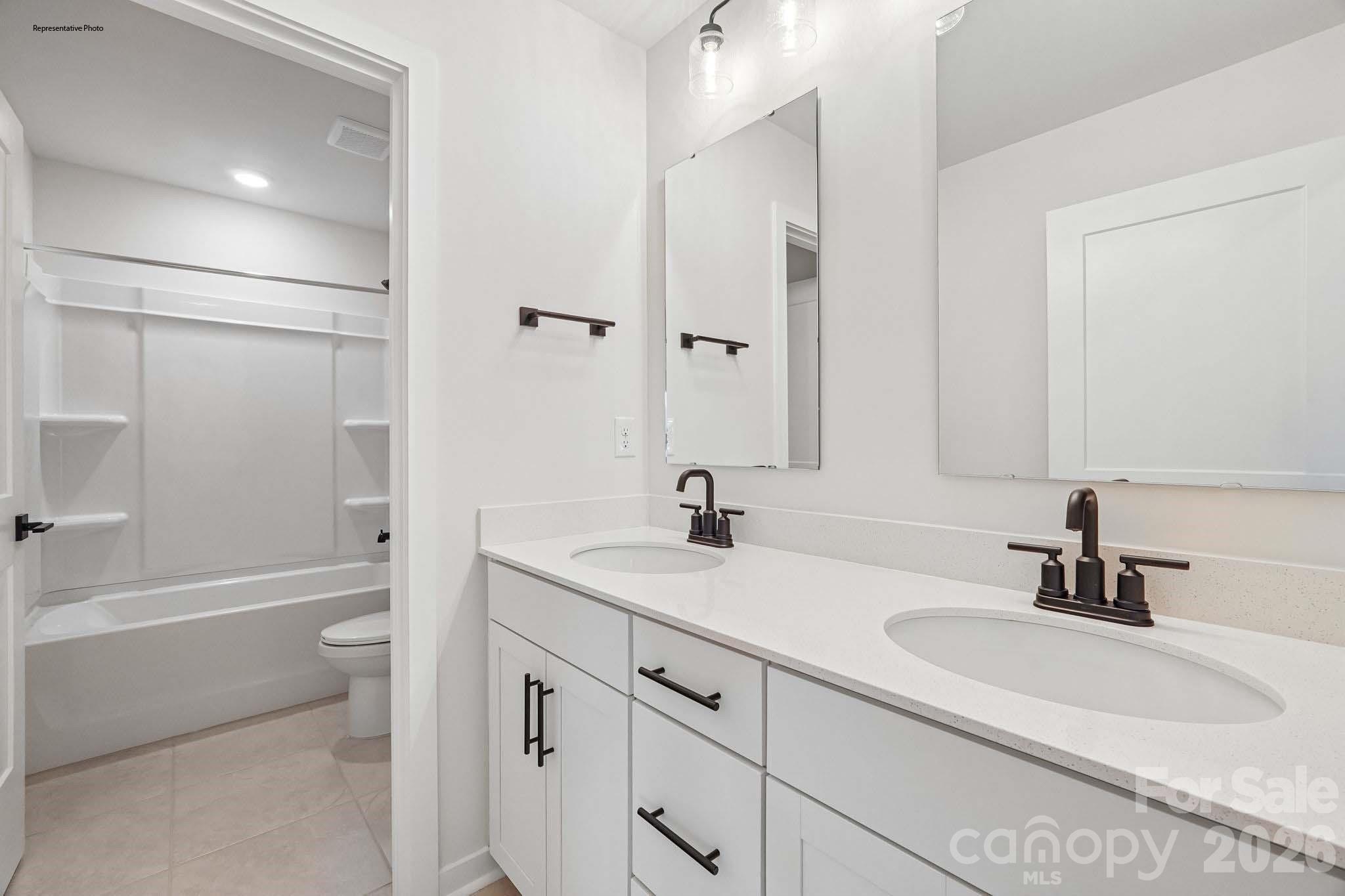 541 Mahogany Road York, SC 29745 - Photo 22 of 32 a bathroom with a sink a toilet and a tub