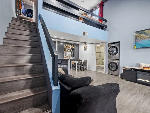 a living room with furniture and a stair